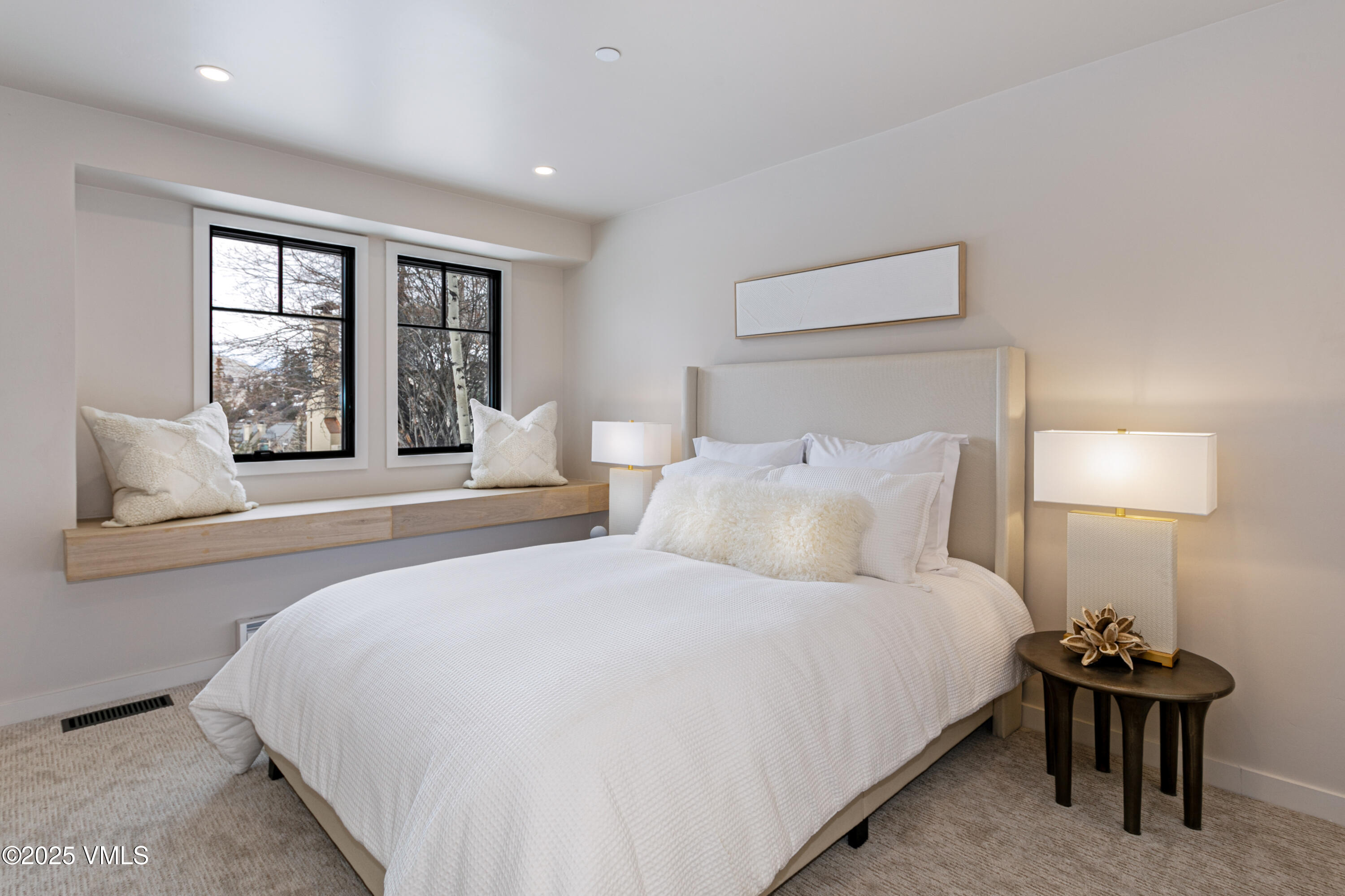 17 Meadows Court, Unit E1 Beaver Creek, CO 81620 - Photo 33 of 39 a bedroom with a bed and a night stand