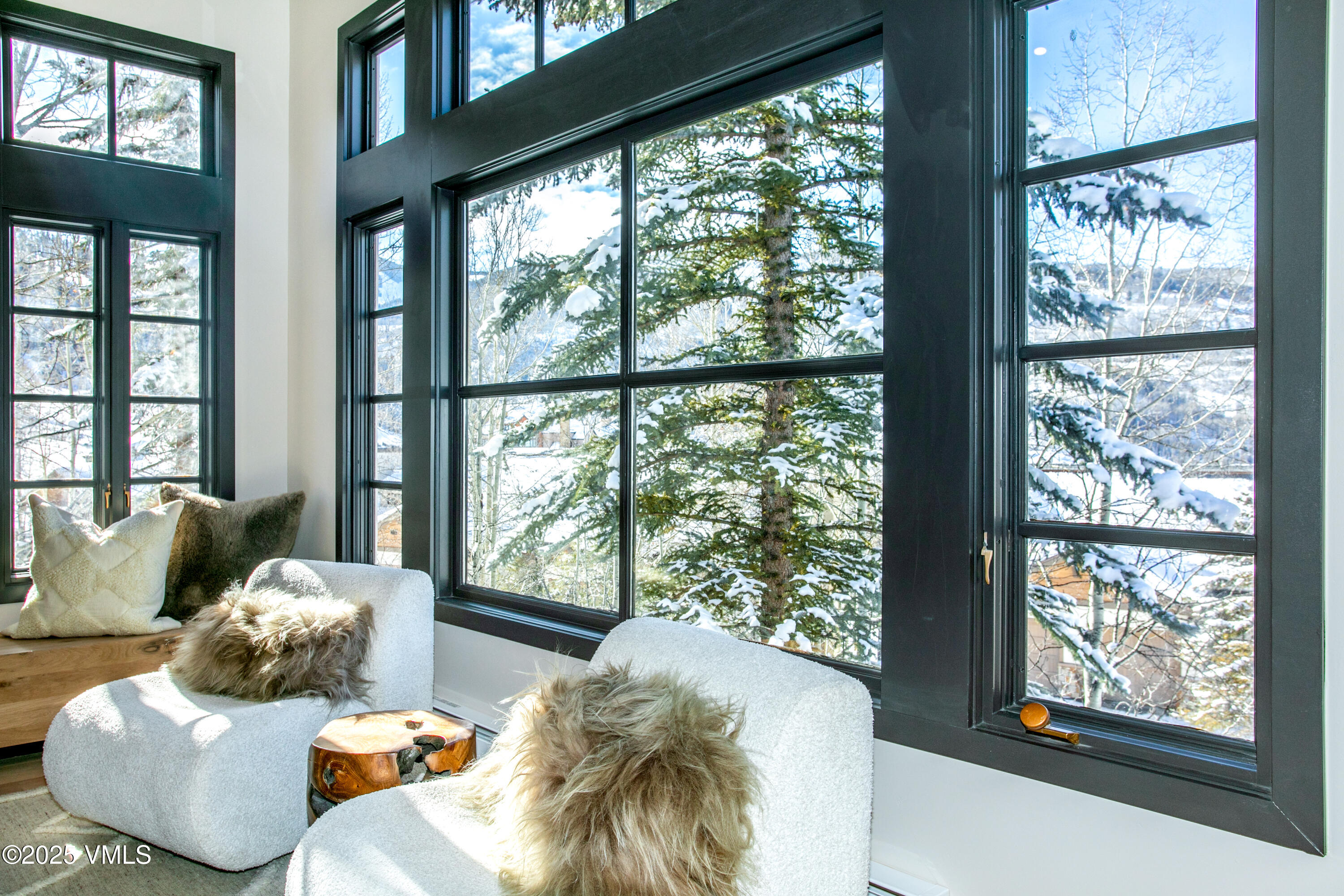 17 Meadows Court, Unit E1 Beaver Creek, CO 81620 - Photo 8 of 39 a living room with furniture and large windows