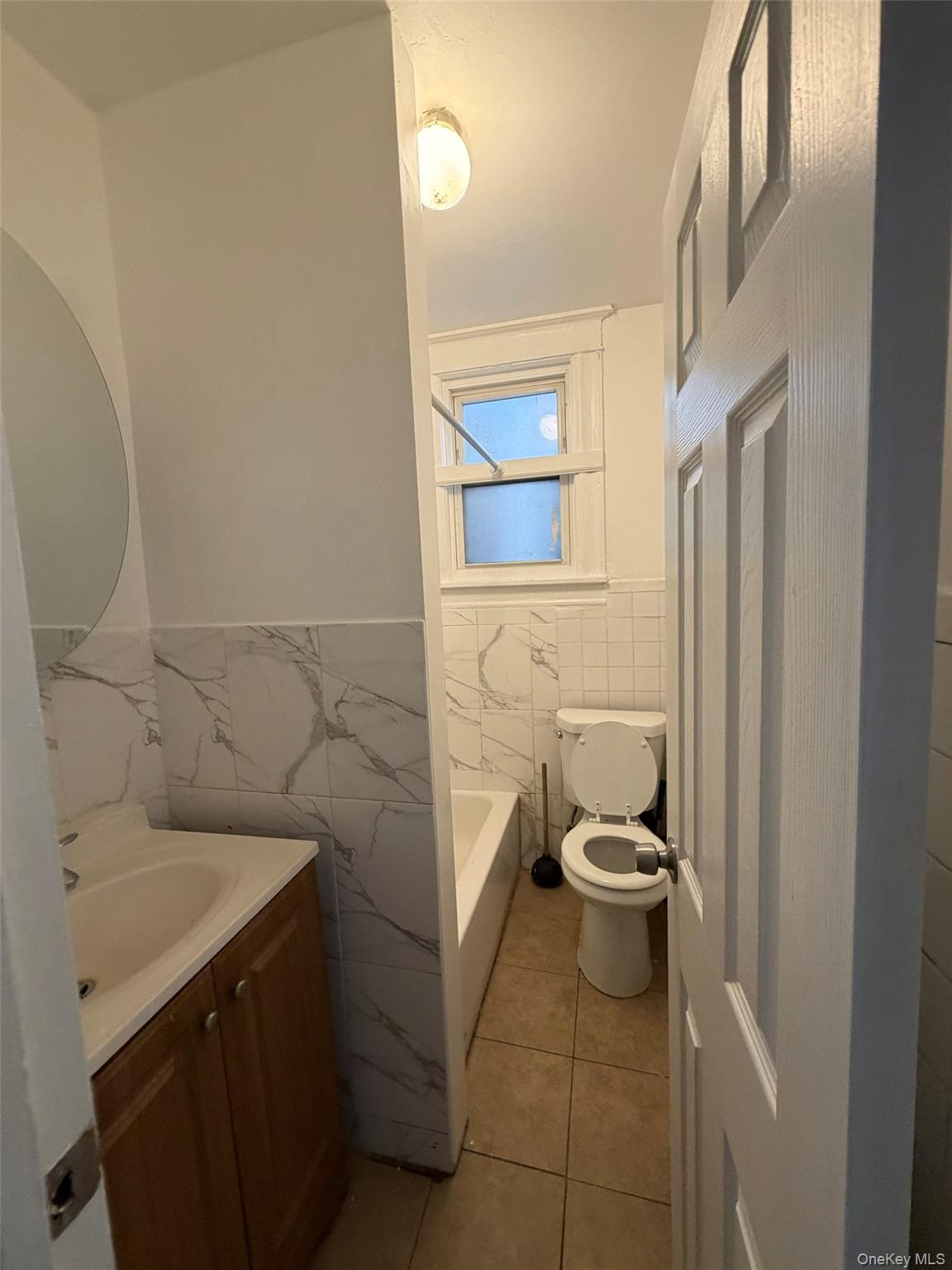 4 Ritters Lane, Unit 1 Yonkers, NY 10703 - Photo 18 of 22 a bathroom with a sink and a toilet