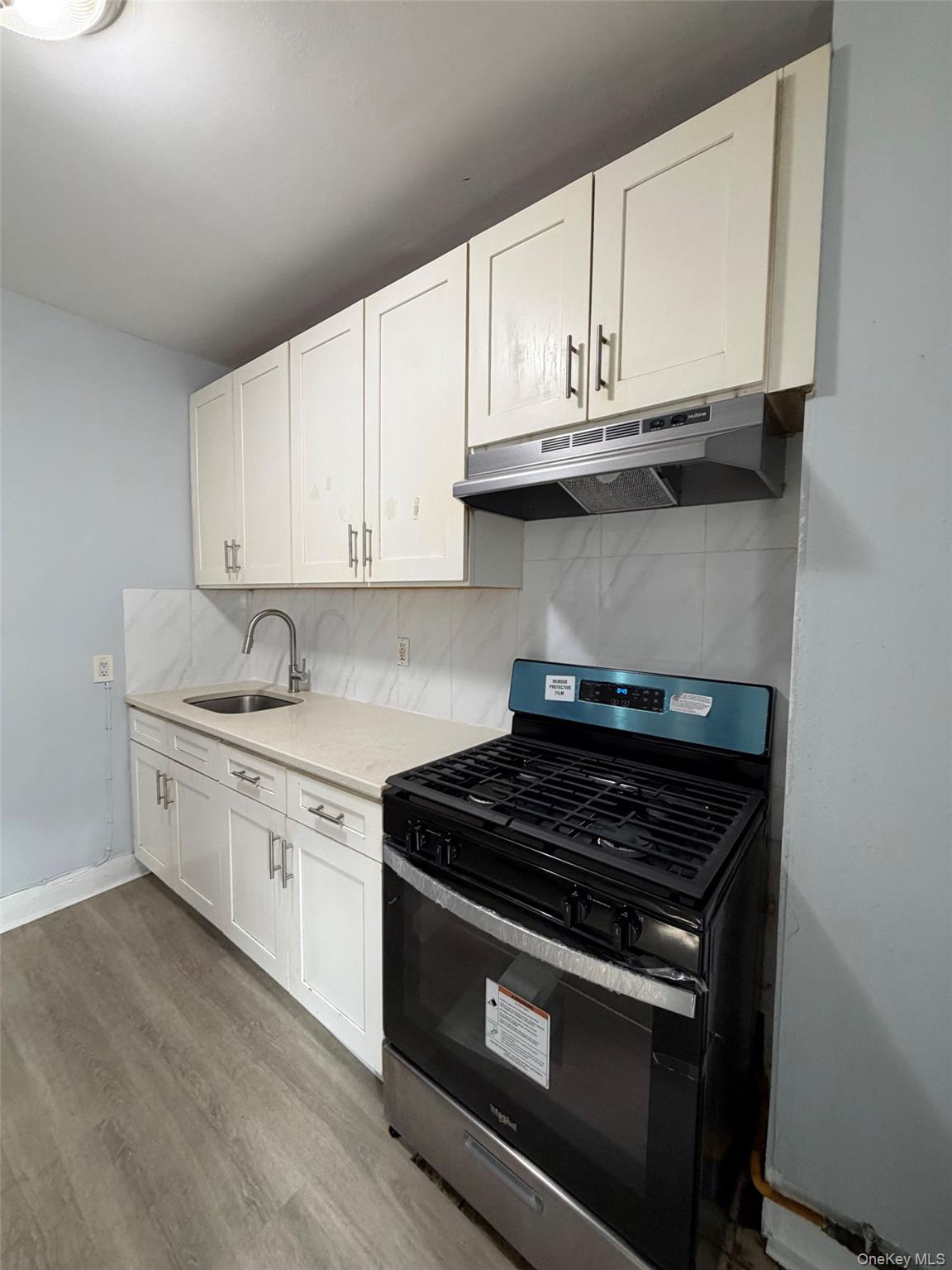 4 Ritters Lane, Unit 1 Yonkers, NY 10703 - Photo 3 of 22 a white stove top oven sitting inside of a kitchen