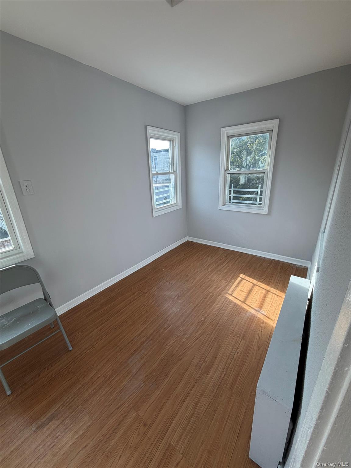 4 Ritters Lane, Unit 1 Yonkers, NY 10703 - Photo 7 of 22 wooden floor in an empty room with a window