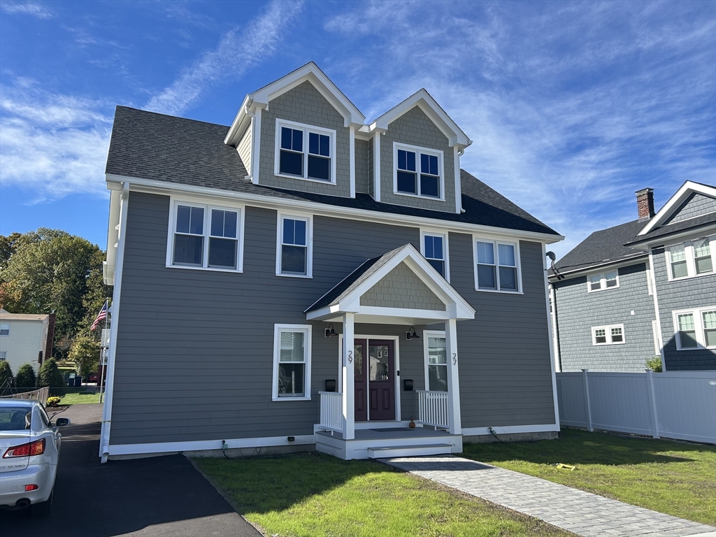 a front view of a house with a yard