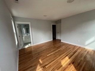 29 Orange Street, Unit B Boston, MA 02131 - Photo 14 of 23 a view of a bedroom with wooden floor