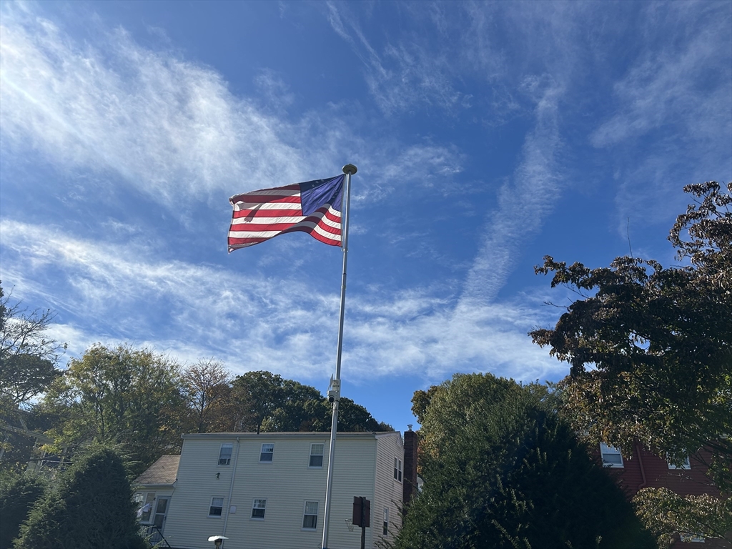 29 Orange Street, Unit B Boston, MA 02131 - Photo 22 of 23 a backyard of a house with lots of green space