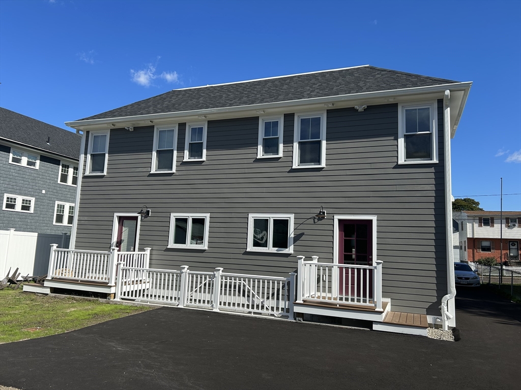29 Orange Street, Unit B Boston, MA 02131 - Photo 23 of 23 a front view of a house with a yard