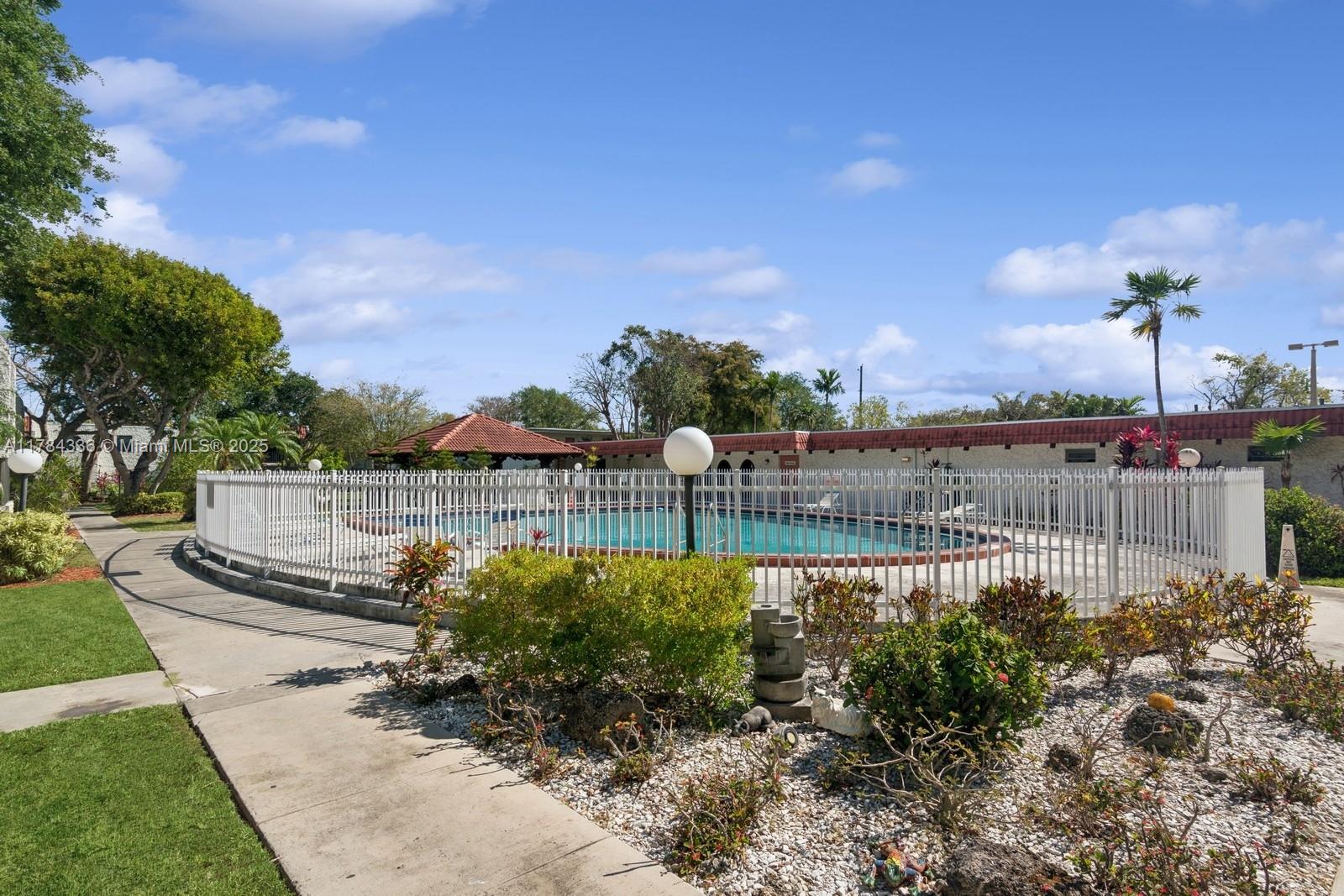 8701 Southwest 141st Street, Unit A5 Palmetto Bay, FL 33176 - Photo 16 of 19 a view of a lake with a city view