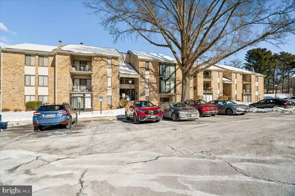 a view of a cars parked in front of a building