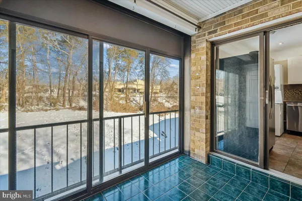 a view of a porch with a glass door