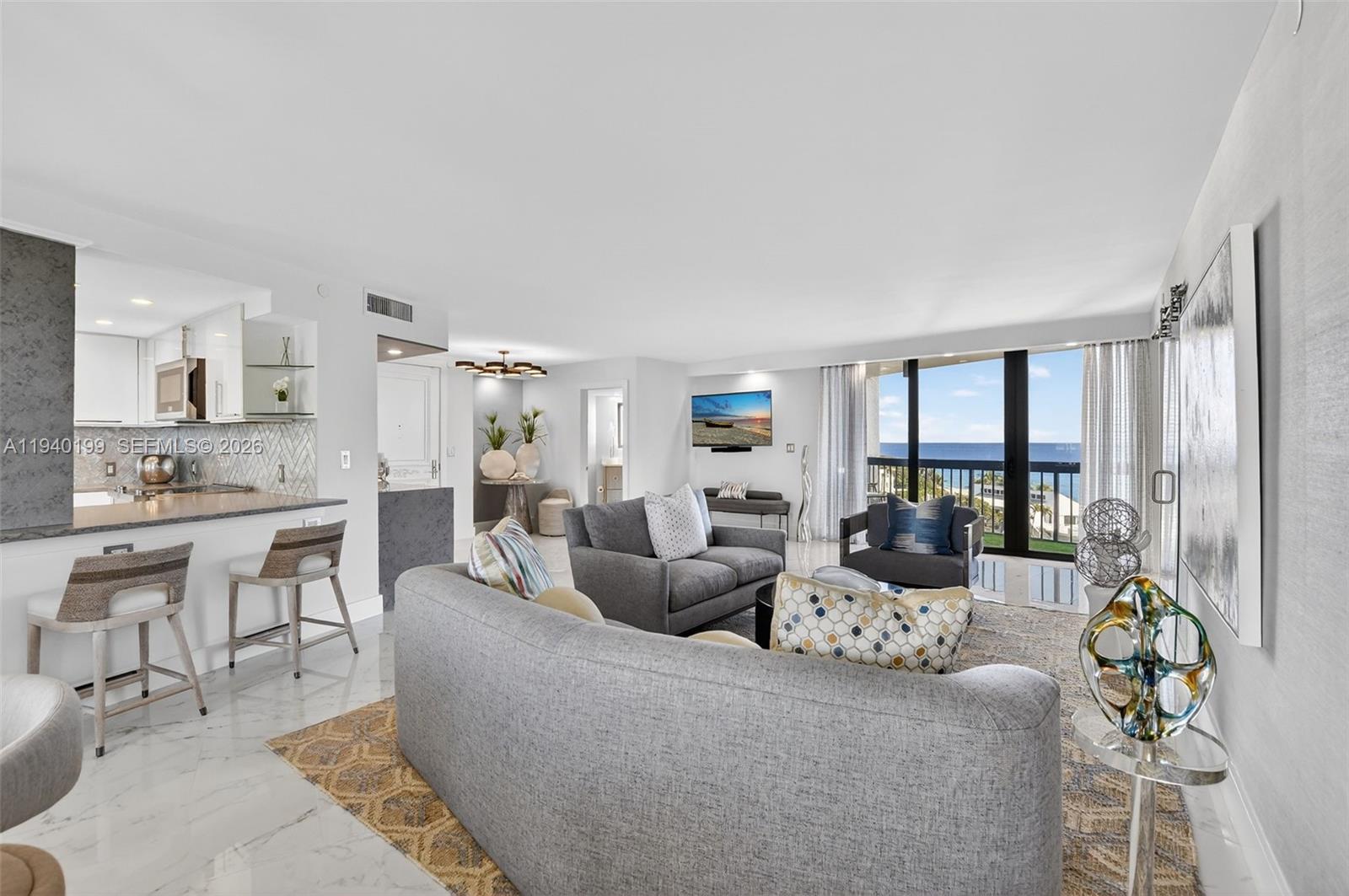 4545 North Ocean Boulevard, Unit 8B Boca Raton, FL 33431 - Photo 12 of 78 a living room with furniture and a large window