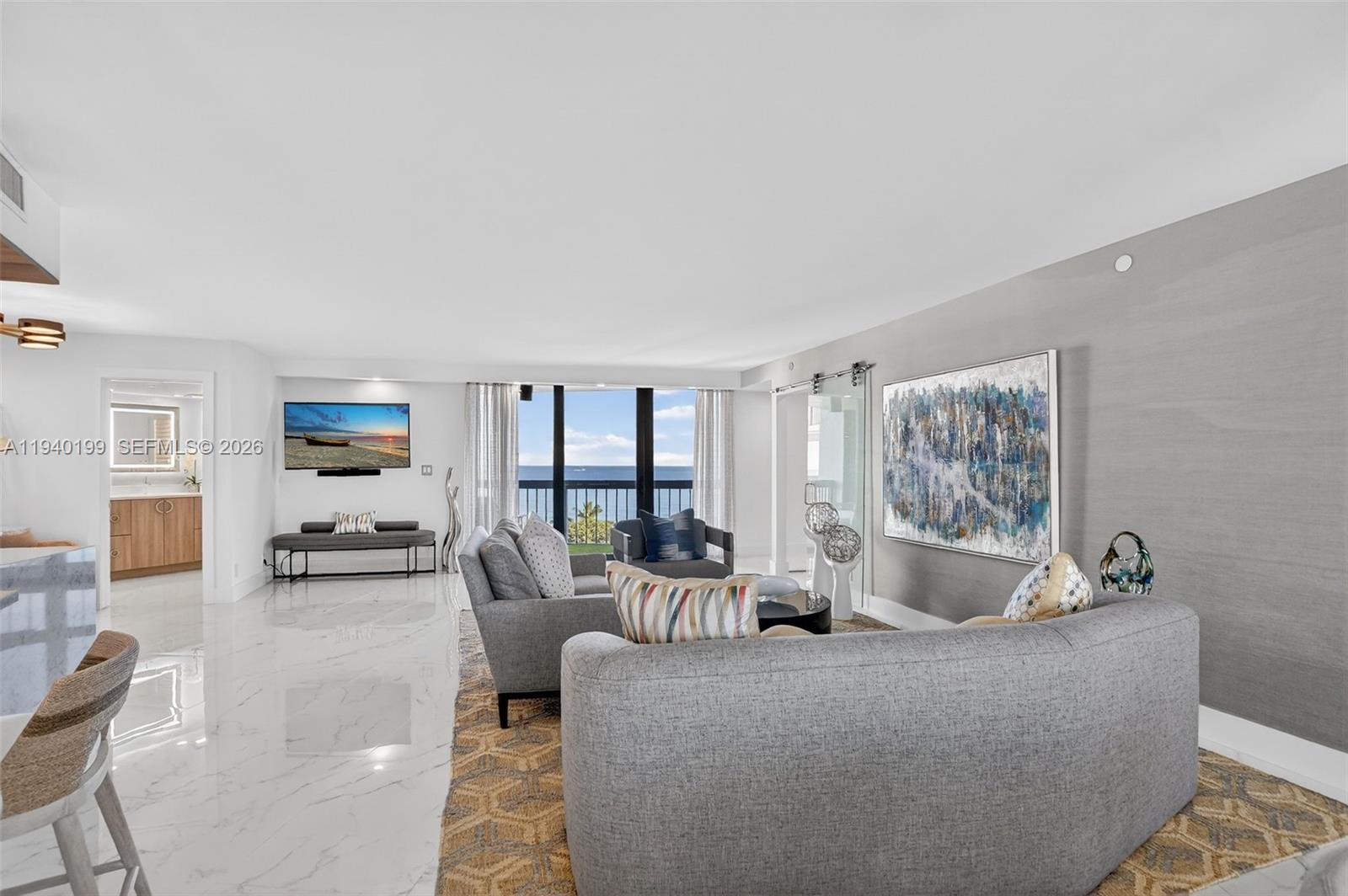 4545 North Ocean Boulevard, Unit 8B Boca Raton, FL 33431 - Photo 16 of 78 a living room with furniture and a large window