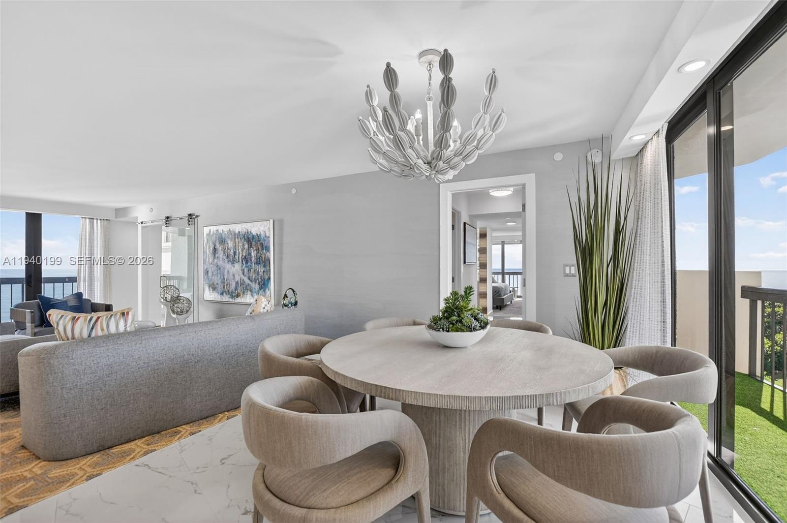 4545 North Ocean Boulevard, Unit 8B Boca Raton, FL 33431 - Photo 23 of 78 a living room with furniture and a large window