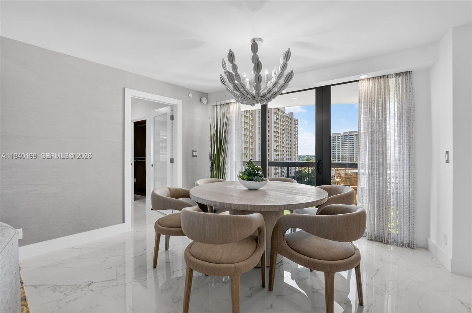 4545 North Ocean Boulevard, Unit 8B Boca Raton, FL 33431 - Photo 24 of 78 a dining room with furniture and large windows