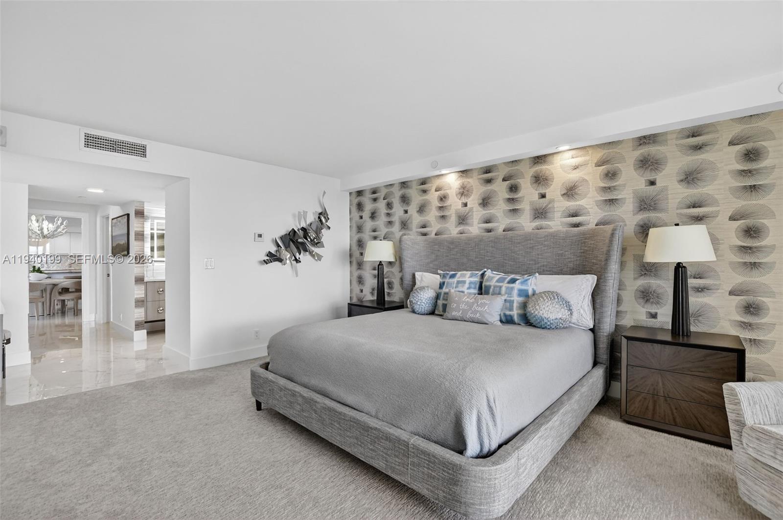 4545 North Ocean Boulevard, Unit 8B Boca Raton, FL 33431 - Photo 32 of 78 a bedroom with a large bed and a chandelier