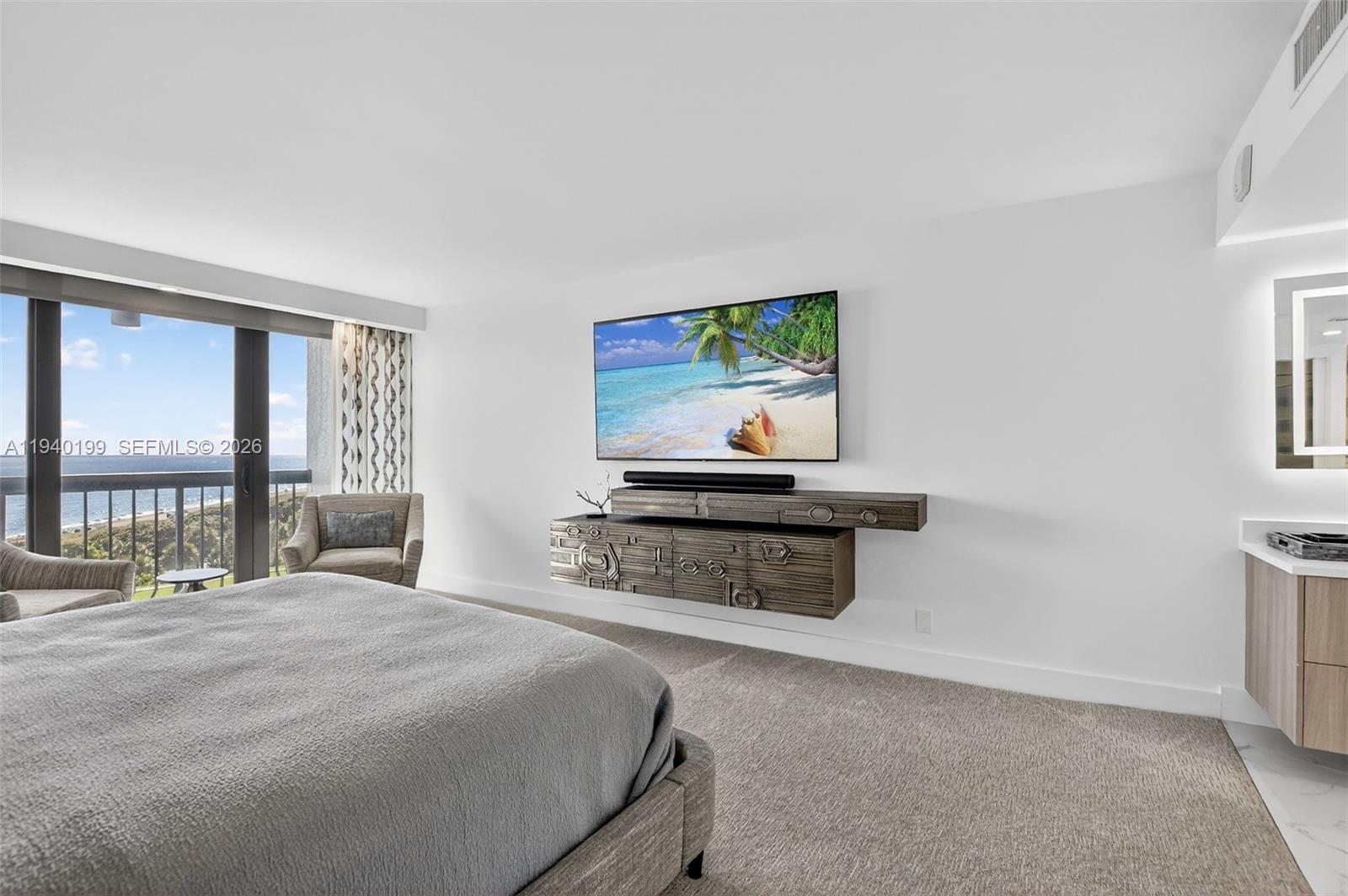 4545 North Ocean Boulevard, Unit 8B Boca Raton, FL 33431 - Photo 34 of 78 a bedroom with a bed and a flat screen tv