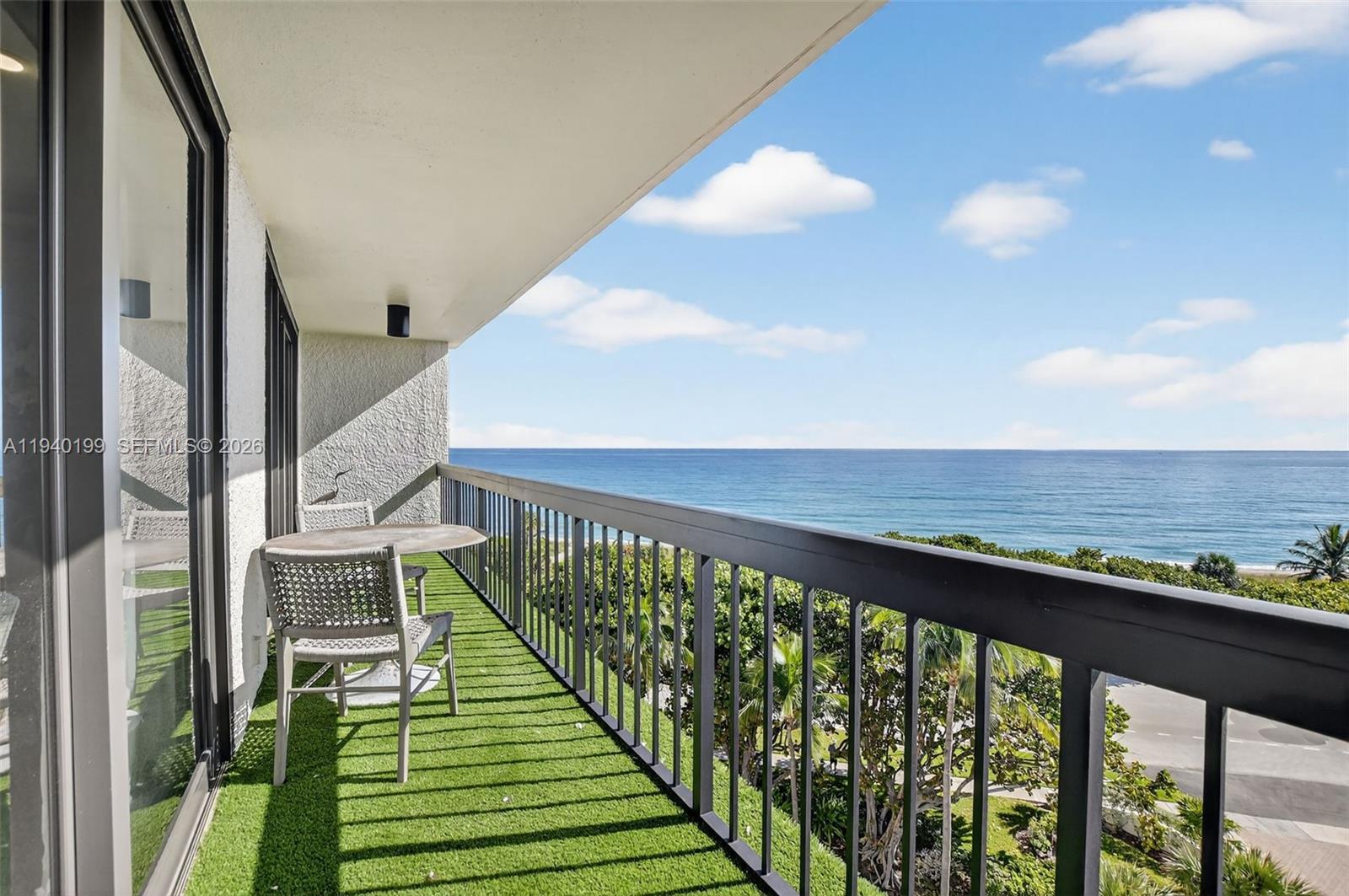 4545 North Ocean Boulevard, Unit 8B Boca Raton, FL 33431 - Photo 38 of 78 a view of a balcony with wooden floor and fence