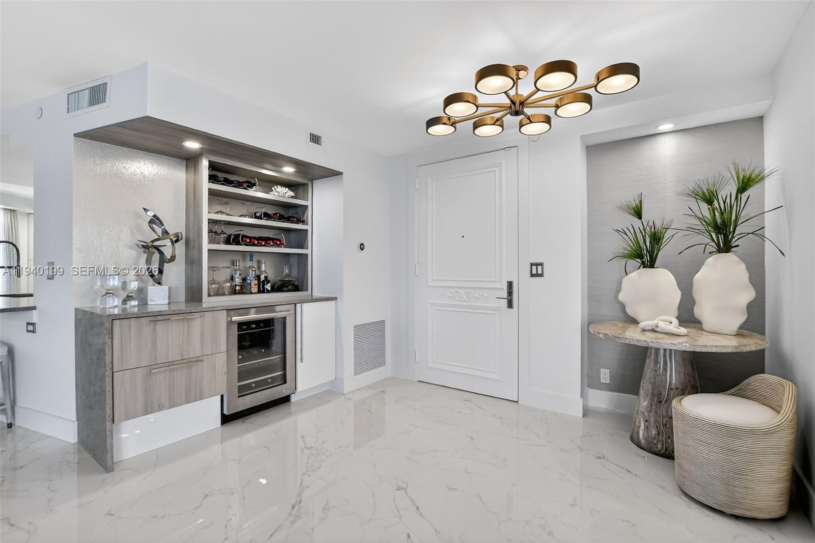 4545 North Ocean Boulevard, Unit 8B Boca Raton, FL 33431 - Photo 4 of 78 a kitchen with stainless steel appliances a white refrigerator a stove and a wooden floors