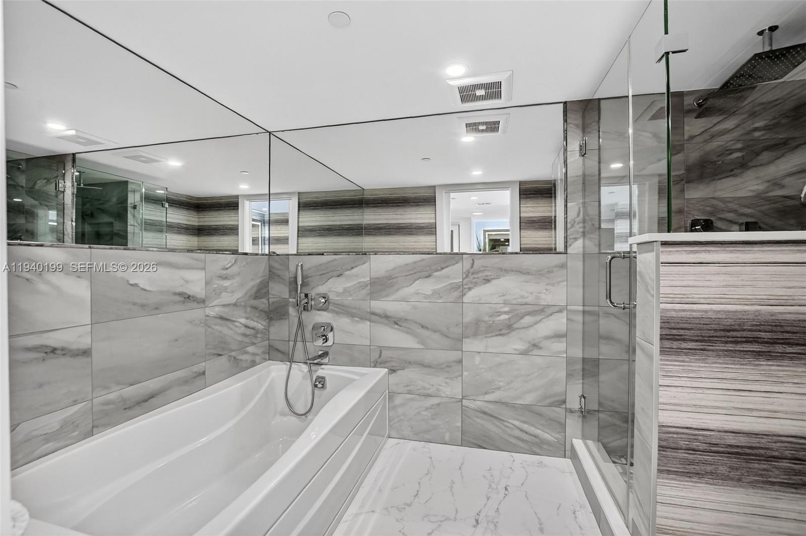 4545 North Ocean Boulevard, Unit 8B Boca Raton, FL 33431 - Photo 41 of 78 a bathroom with a bathtub and a shower