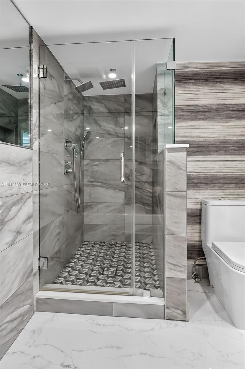 4545 North Ocean Boulevard, Unit 8B Boca Raton, FL 33431 - Photo 42 of 78 a bathroom with a shower and toilet