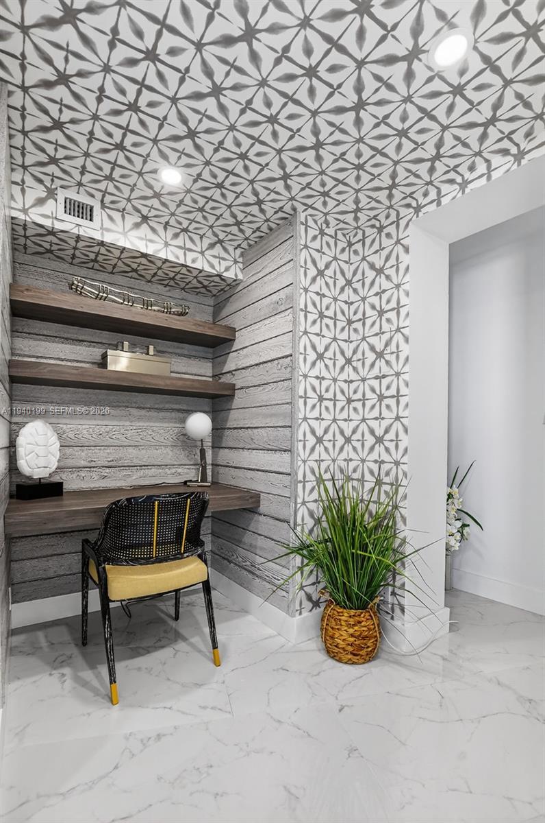 4545 North Ocean Boulevard, Unit 8B Boca Raton, FL 33431 - Photo 45 of 78 a bench sitting in middle of a building