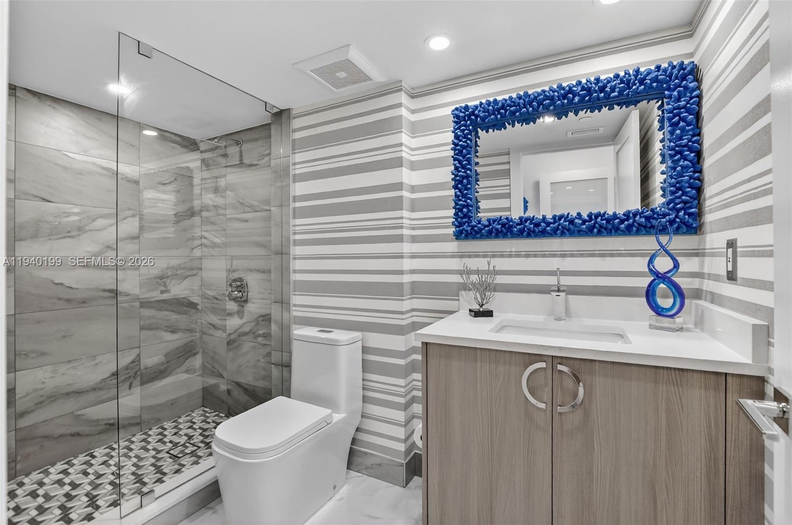 4545 North Ocean Boulevard, Unit 8B Boca Raton, FL 33431 - Photo 55 of 78 a bathroom with a sink mirror toilet and shower