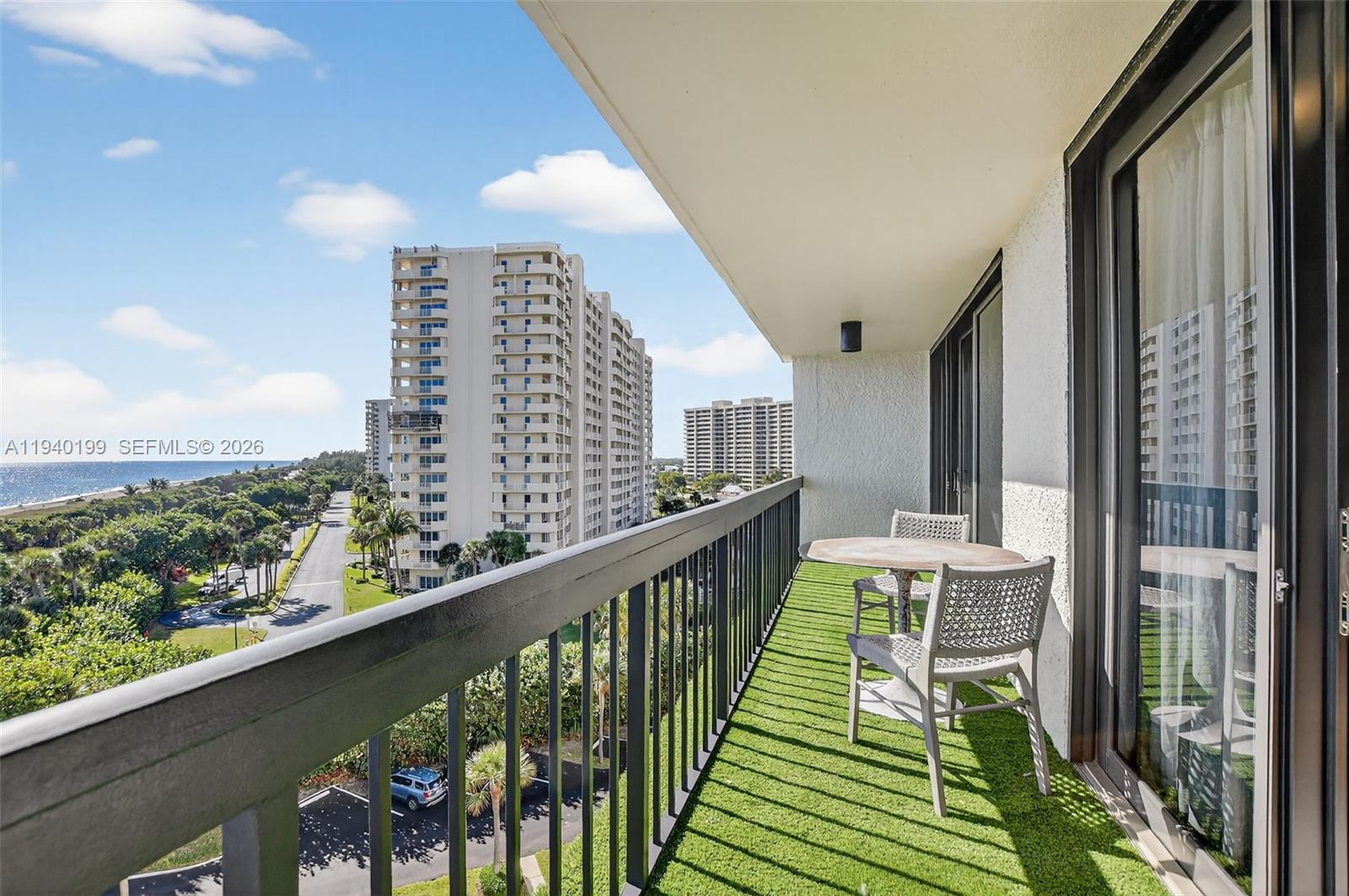 4545 North Ocean Boulevard, Unit 8B Boca Raton, FL 33431 - Photo 57 of 78 a view of balcony with wooden floor and seating space