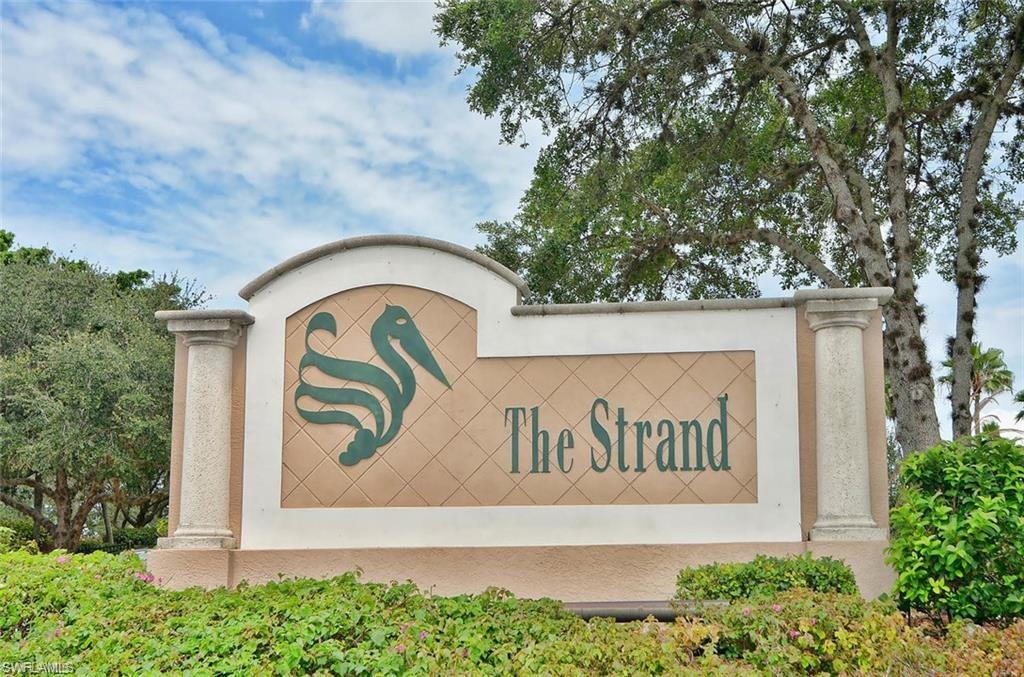 6017 Trophy Drive, Unit 601 Naples, FL 34110 - Photo 11 of 24 a sign that is on the side of the road