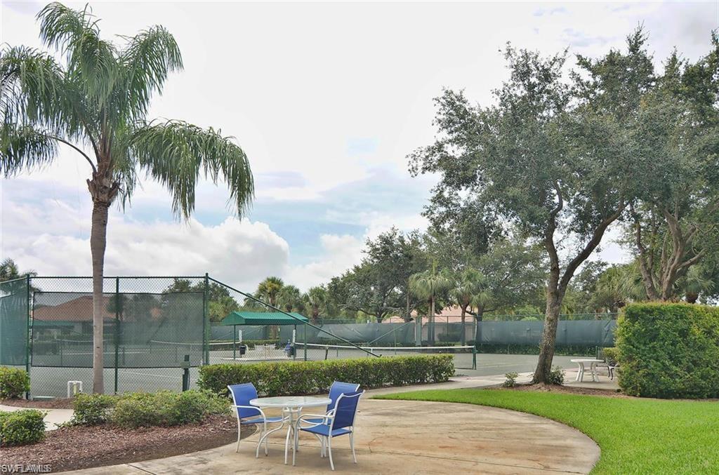 6017 Trophy Drive, Unit 601 Naples, FL 34110 - Photo 17 of 24 an outdoor view of a garden with sitting area