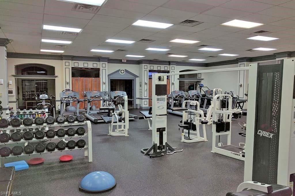 6017 Trophy Drive, Unit 601 Naples, FL 34110 - Photo 18 of 24 a view of a room with gym equipment