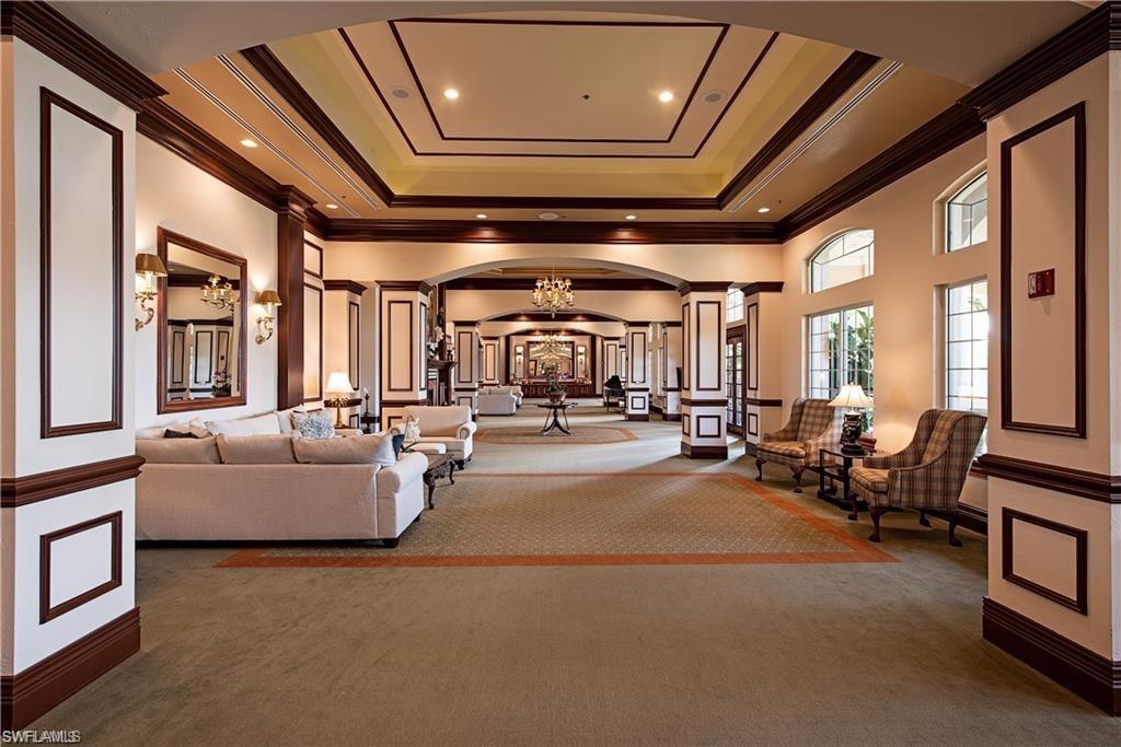6017 Trophy Drive, Unit 601 Naples, FL 34110 - Photo 22 of 24 a living room with furniture and a large window