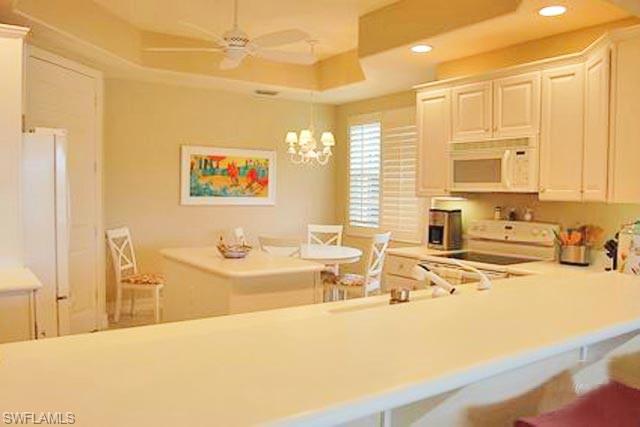 6017 Trophy Drive, Unit 601 Naples, FL 34110 - Photo 5 of 24 a spacious bathroom with a tub a sink and a large mirror