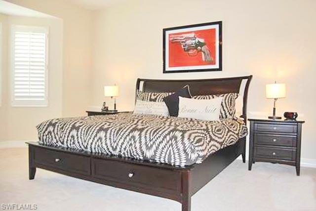 6017 Trophy Drive, Unit 601 Naples, FL 34110 - Photo 6 of 24 a bedroom with a bed and window