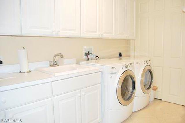 6017 Trophy Drive, Unit 601 Naples, FL 34110 - Photo 10 of 24 a utility room with dryer and washer
