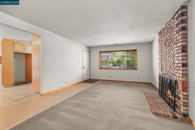 a view of an empty room and window