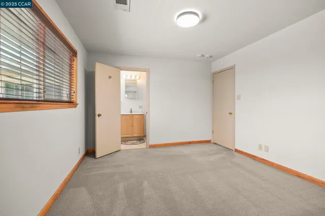 a bathroom with a toilet sink and shower