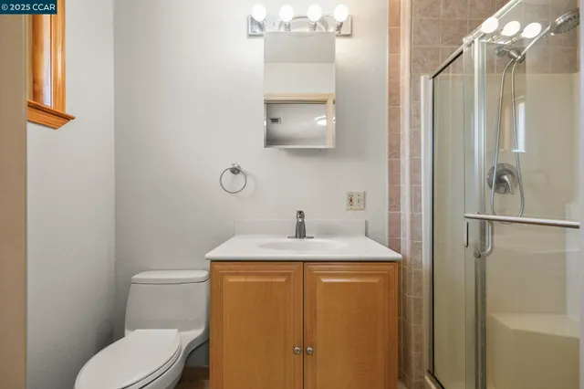 a bedroom with a bed and a potted plant