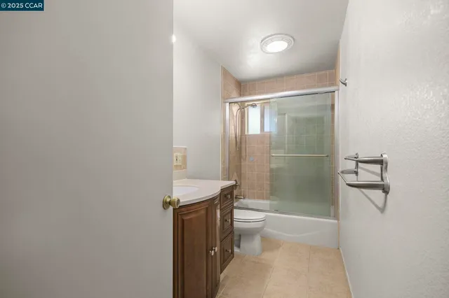 a utility room with a sink and a mirror