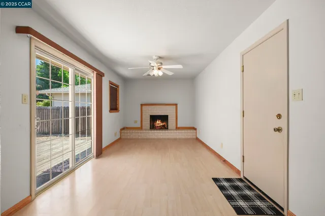a view of an empty room with a window