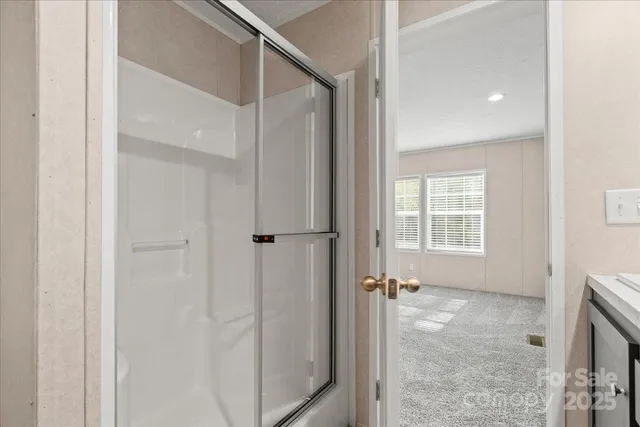 a large kitchen with kitchen island a sink dishwasher a stove a refrigerator and a oven with wooden floor