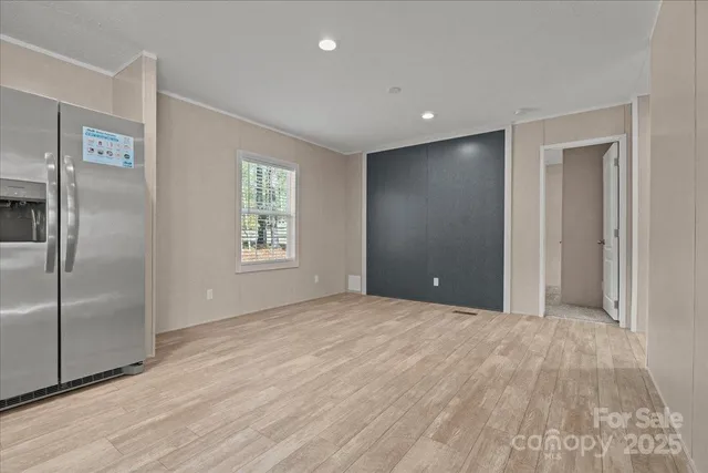 a view of large kitchen with stainless steel appliances kitchen island