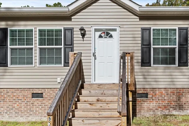 a view of a house with large windows