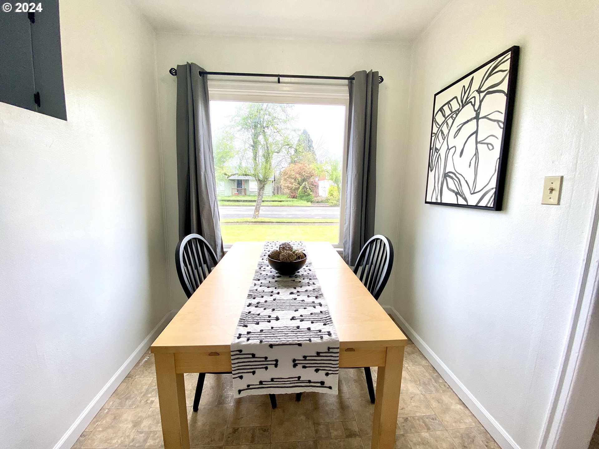 2425 E Street Springfield, OR 97477 - Photo 22 of 36 a view of a dining room with furniture window and wooden floor