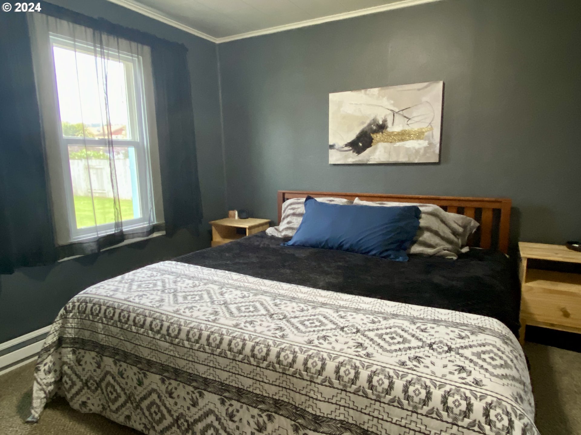 2425 E Street Springfield, OR 97477 - Photo 24 of 36 a bedroom with a bed and a window