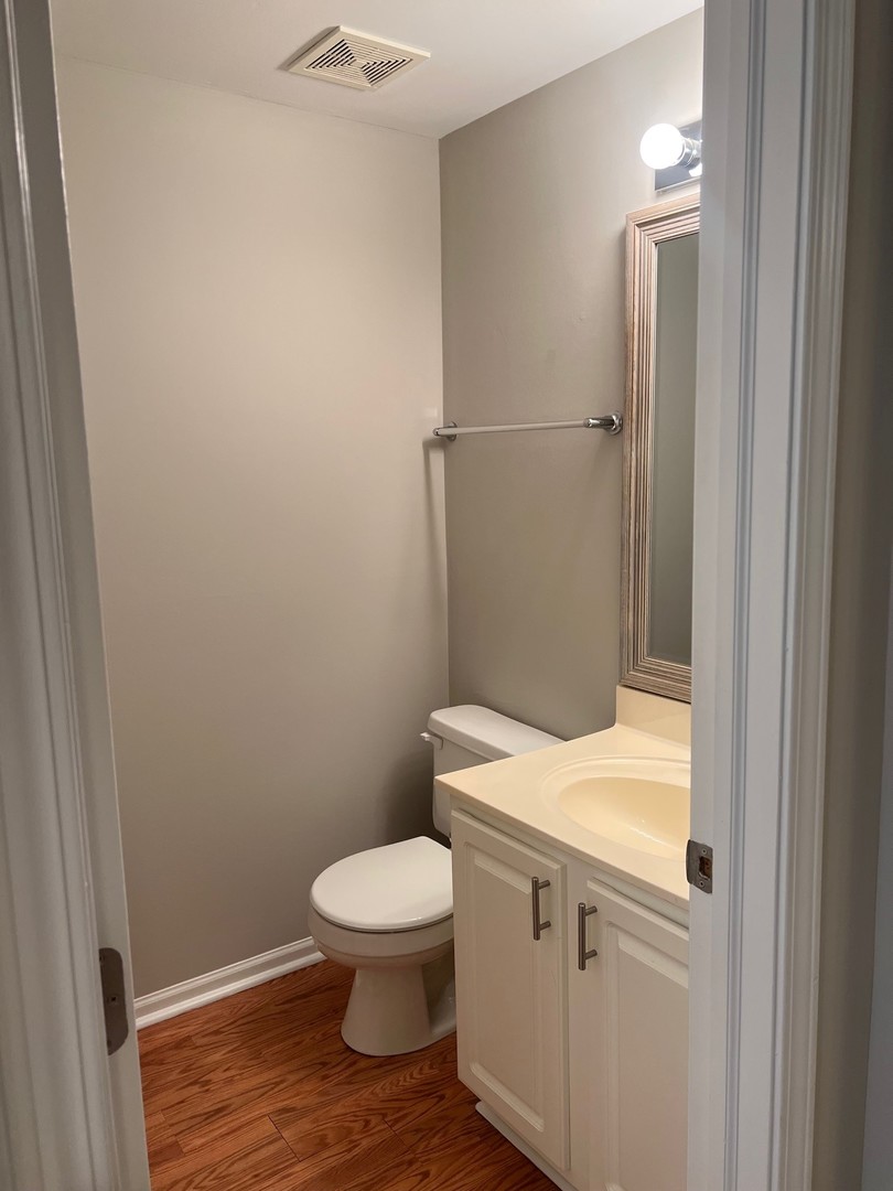 3393 Ravinia Circle Aurora, IL 60504 - Photo 4 of 14 a white toilet sitting next to a shower