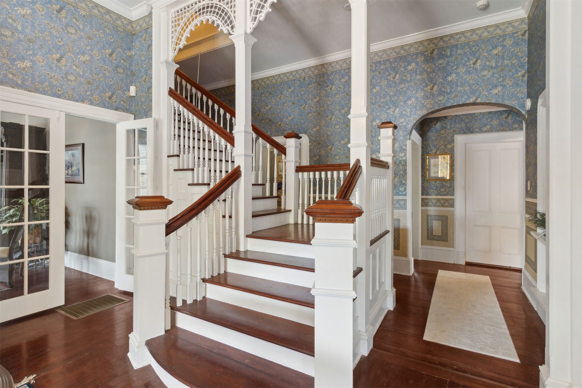 327 South 7th Street Fernandina Beach, FL 32034 - Photo 19 of 71 a view of staircase with wooden floor and a large window