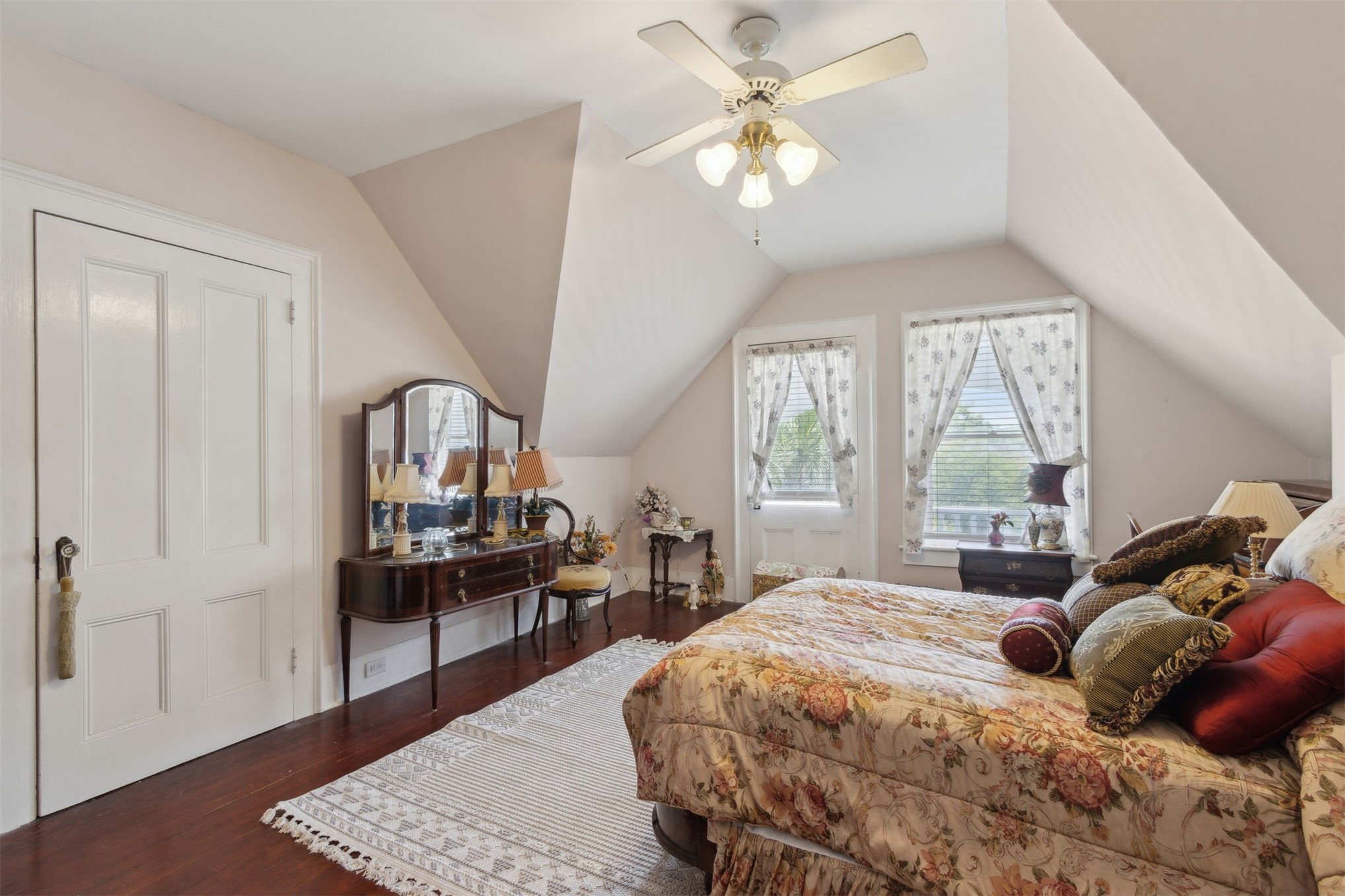 327 South 7th Street Fernandina Beach, FL 32034 - Photo 49 of 71 a bedroom with a bed wooden floor and a table