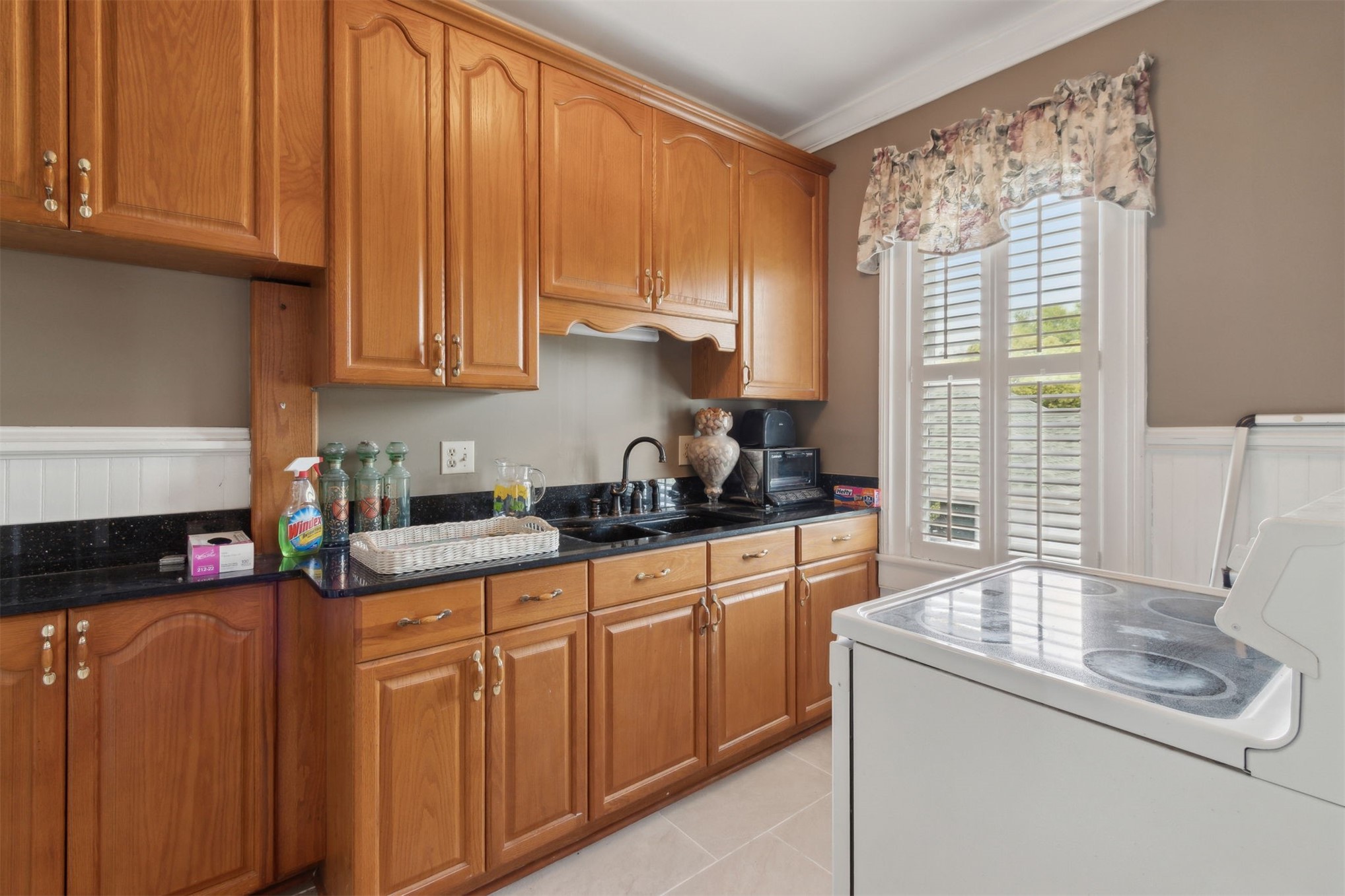 327 South 7th Street Fernandina Beach, FL 32034 - Photo 56 of 71 a kitchen with stainless steel appliances granite countertop a sink a stove and a refrigerator