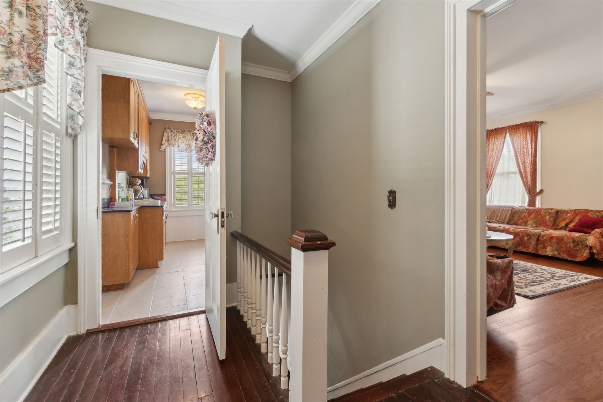 327 South 7th Street Fernandina Beach, FL 32034 - Photo 57 of 71 a view of a hallway and a livingroom with wooden floor