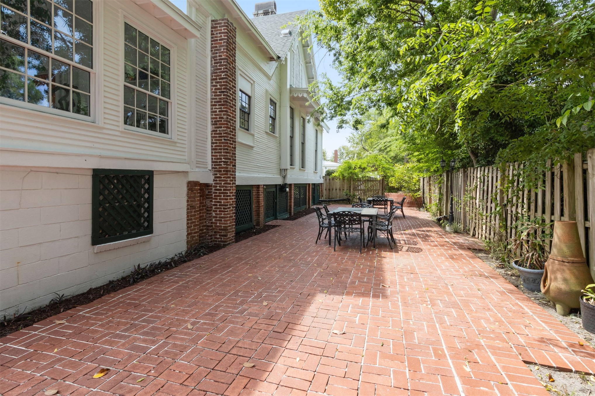 327 South 7th Street Fernandina Beach, FL 32034 - Photo 58 of 71 a view of a patio with a table and chairs and a barbeque