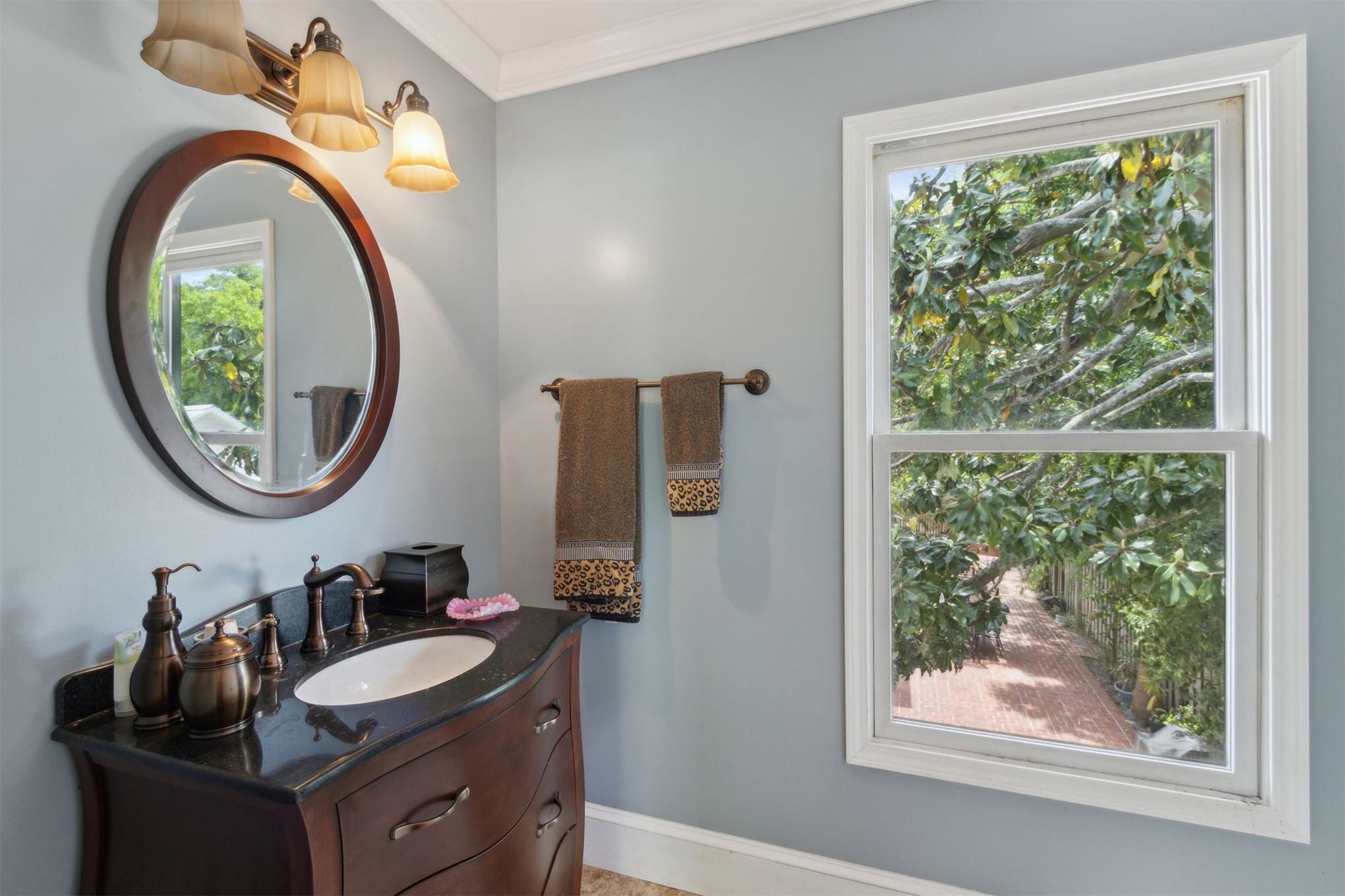 327 South 7th Street Fernandina Beach, FL 32034 - Photo 69 of 71 a bathroom with a sink and a mirror