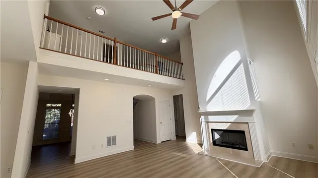 a kitchen with stainless steel appliances white cabinets and a window